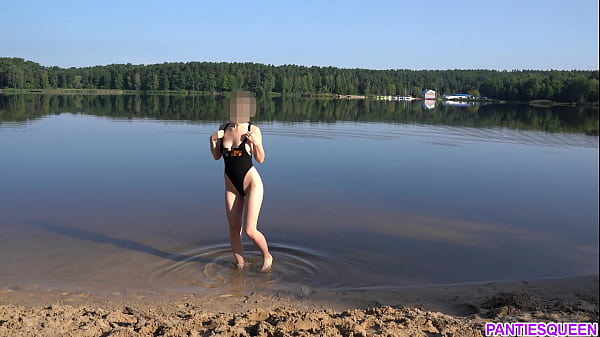 Naked girl goes skinny dipping in public beach