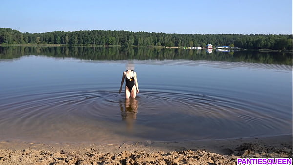 Naked girl goes skinny dipping in public beach