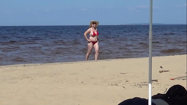 Nimble mature mommy has fun with young guys on the beach))) Thumbnail