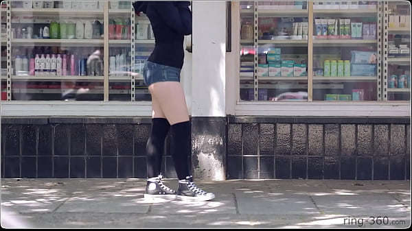 Brunette girl with skateboard flashing in public