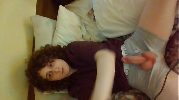 Curly hair femboy plays with big thick dick