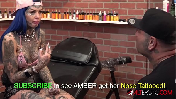 Behind the scenes for Amber Luke's new face tattoo