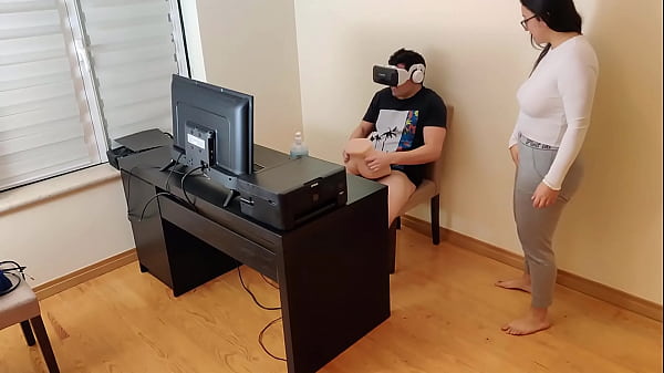 Hot stepmother masturbates next to her son while he watches porn with virtual reality glasses
