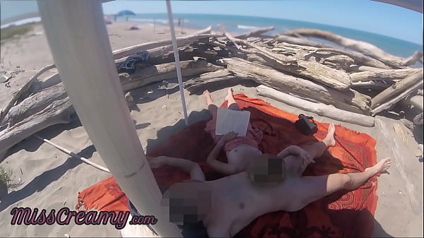 Risky Public Handjob on the Canary Beach Caught reading a book - MissCreamy