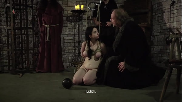 Mooing Witch – Naked maid with hanging natural tits is tied up and pulled up to the ceiling to be tormented and humiliated while dangling from a rope (preview)