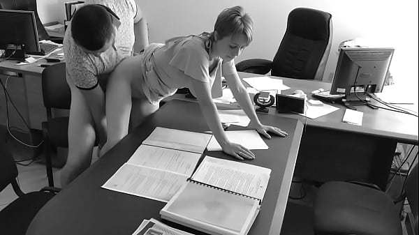 The boss fucks his tiny secretary on the office table and films it on hidden camera