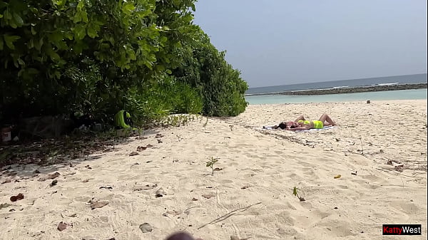 Pervert cummed on girls while they were sunbathing on a public beach