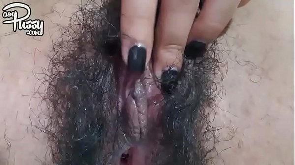 Extreme close-up hairy pussy masturbation