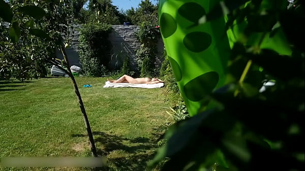 A NEIGHBOR SPIES ON A NAKED BIG-BOOBED NUDIST WOMAN