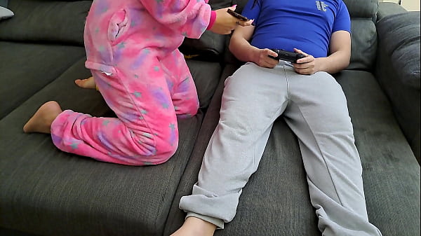 Stepsister sucks stepbrother and eats his sperm while he plays video games