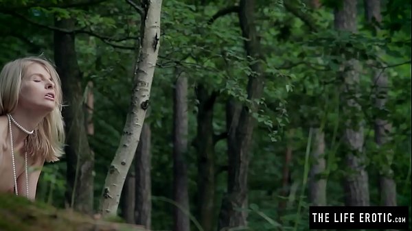 Skinny girl fucks herself hard in the forest