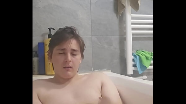 Chubby boy jerks off and cums in bathtub