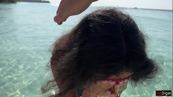 Pissed on girl on a public beach - She was shocked