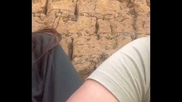 Two lesbians touch each other to orgasm on the corner of a town trying to avoid being seen by anyone