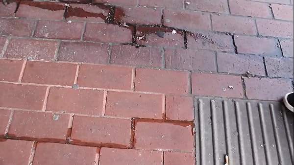 Beautiful and very slutty slut shows her ass in public while pissing between her legs