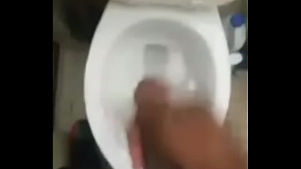 Black Banana jerks off in the toilet