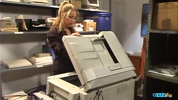 Instead of fixing the photocopier the maintenance guy pummels the busty blonde Asian Kianna Dior.