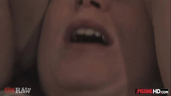 Busty redhead Bella peed on by her two girlfriends