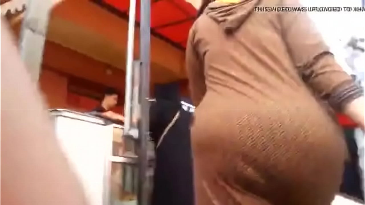 Arab Ass walking in street