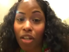  - Ebony chick in white fishnet stockings pissing in the toilet and filming