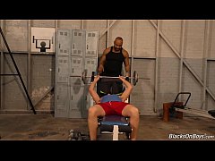  - Muscular white guy goes black in a gym