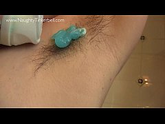  - Sexy scene, Naughty Tinkerbell is shaving her hairy pierced pussy in the shower.