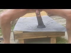  - Gapingman riding a dildo outdoor