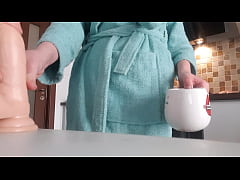  - Petite brunette teen girl undressing and teasing and masturbating pussy in the kitchen on the chair