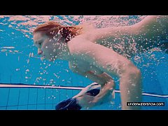  - Teen girl Avenna is swimming in the pool