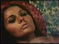  - Busty brunette with a hairy cunt is filmed in retro film