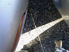  - Pissing between two cars