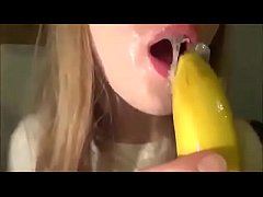  - Cute Girl Sucking a Banana with Condom