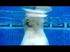  - Ariel Ortiz loves to swim in the pool, while her neighbor watches her masturbate. She is a sexy redhead, who loves to be watched in the pool