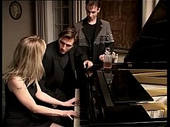 - Blonde whore playing piano and two cocks