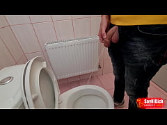 Uncircumcised cock pees on the station toilet